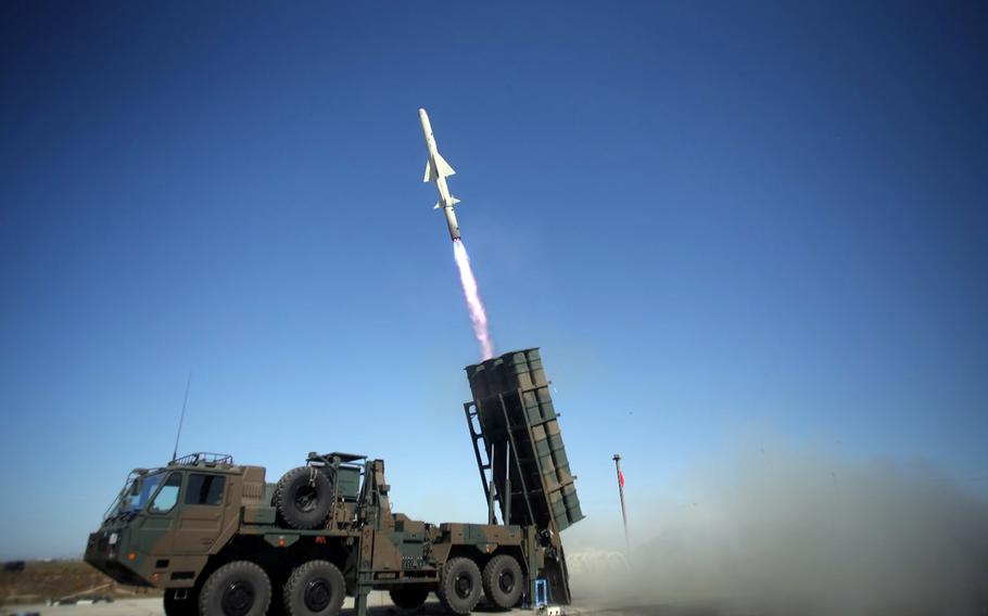 Members of the Japan Ground Self-Defense Force fire a Type-12 missile in this undated photo.