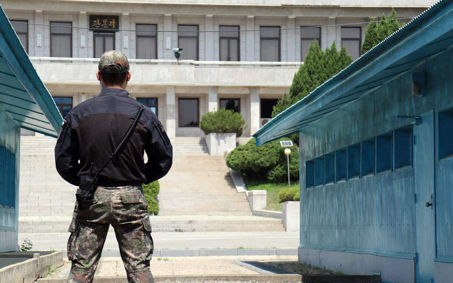 A South Korean soldier stands guard at the Joint Security Area inside the Demilitarized Zone, May 9, 2023. 