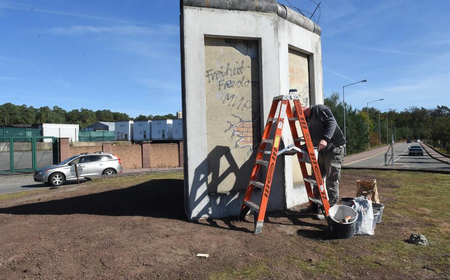 Concrete slabs from the Berlin Wall were recently moved to a more visible location at Ramstein Air Base, Germany. The three sections of the wall now occupy a place in a traffic circle by the base mall.