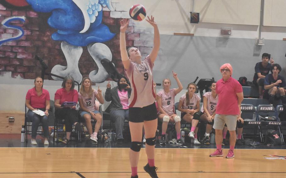 Aviano setter Mayci Salmon starts her team's offense on Saturday, Oct. 15, 2022, in a match against the Ansbach Cougars. The team wore pink in support of National Breast Cancer Awareness Month and coach Michael Gros sported a pink wig.