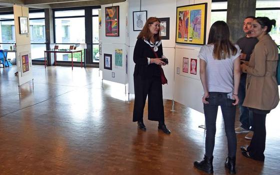 Visitors mingle at the opening night of the art exhibit in 2018. The annual German-American student art exhibit featuring work from Department of Defense and local German schools runs from Thursday to May 8 in Kaiserslautern city hall. 

