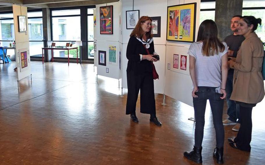 Visitors mingle at the opening night of the art exhibit in 2018. The annual German-American student art exhibit featuring work from Department of Defense and local German schools runs from Thursday to May 8 in Kaiserslautern City Hall. 