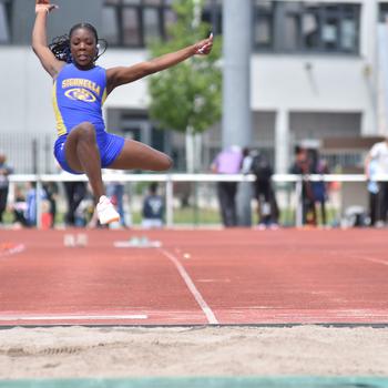 Rickalia Goss jumps to a title.