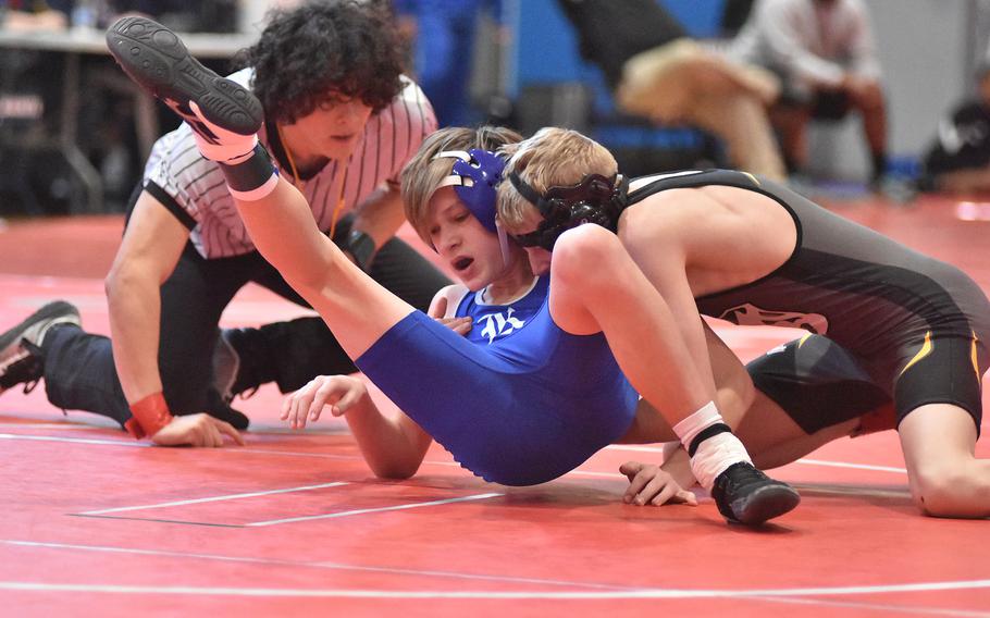 Vicenza's Garrett Kelsay upends Rota's Robert York on the way to a technical fall at 113 pounds Saturday, Feb. 4, 2023, at the DODEA-Europe Southern Europe regional at Aviano Air Base, Italy.