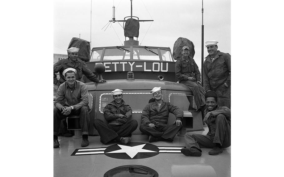 Members of the 7th Crash Rescue Boat Flight, the seagoing flyboys, on the “Betty-Lou,” one of the four 63-foot converted PT boats that provide marine rescue services in the event of an air crash at sea.