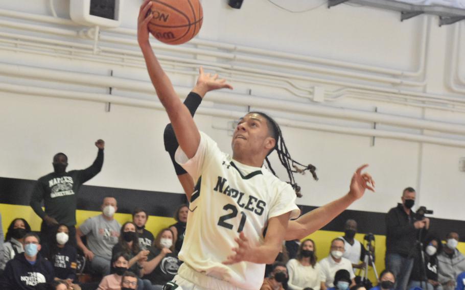 Naples' Cameron Collins drives to the basket Saturday, March 5, 2022, during the championship game of the DODEA-Europe Division II boys basketball title game.