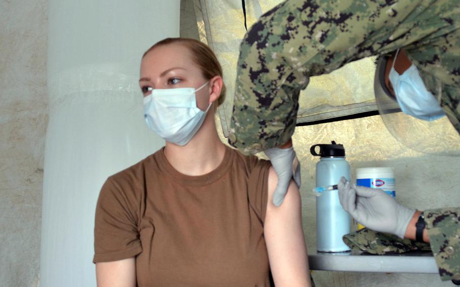 A staff member at U.S. Naval Hospital Okinawa receives the influenza vaccine at Camp Foster, Friday, Oct. 1, 2021.