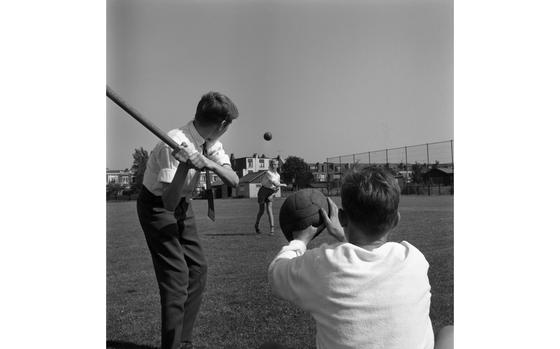 Haarlem, the Netherlands, June 4, 1961:  Although baseball is quite popular in the Netherlands, one major problem is the getting equipment to play it as it's all made in the United States and import taxes are high. Kids - like the ones playing the game here on a field in Haarlem - use old soccer balls as catcher’s mitts and table legs as baseball bats. They call it "honkball" in Holland and the Dutch have really taken to the old ball game. Haarlem is considered the center of Dutch honkball - honk meaning base in Dutch - and the first baseball team in the Netherlands was founded in Haarlem on June 6, 1923. 

Read the full story about "honkball" in Haarlem here
https://www.stripes.com/news/haarlem-take-me-out-to-the-honkbal-game-1.61871

Want to read other historic Stars and Stripes articles? Subscribe to Stars and Stripes’ historic newspaper archive! We have digitized our 1948-1999 European and Pacific editions, as well as several of our WWII editions and made them available online through https://starsandstripes.newspaperarchive.com/

META TAGS:  Europe; Sport; locals; children; kids; boy; baseball; honkball; softball; hitter; catcher; pitcher; leisure; way of life; American culture
