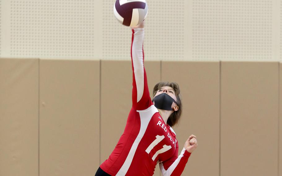 Nile C. Kinnick's Kathryn Withers serves against Matthew C. Perry during Saturday's Japan girls volleyball match. The Red Devils won in straight sets.