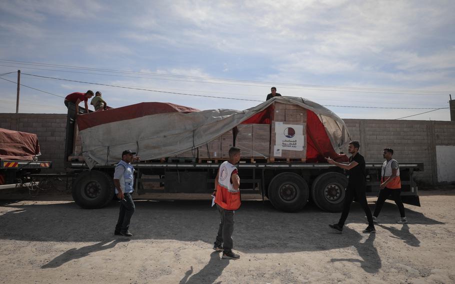The first aid convoy arrives in Gaza through the Rafah land crossing on Saturday.