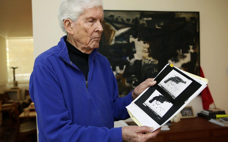 Sen. Robert Kennedy aide Paul Schrade holds an evidence photo of gunman Sirhan Sirhan's revolver with the eight expended shell casings found in the chamber, and the Weisel, Goldstein, and Kennedy bullets, at his home in Los Angeles on May 31, 2018. Schrade, a labor union leader who was shot in the head during the assassination of Robert F. Kennedy and spent decades convinced that Sirhan wasn't the killer, died Wednesday, Nov. 9, 2022, of natural causes. He was 97. 