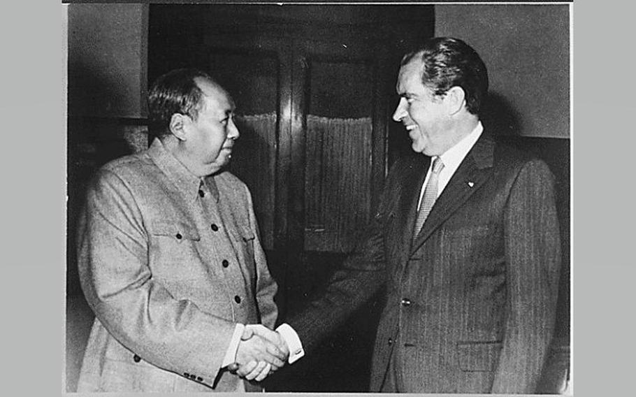 Chairman Mao Zedong shakes hads with President Richard Nixon on Feb. 21, 1972.