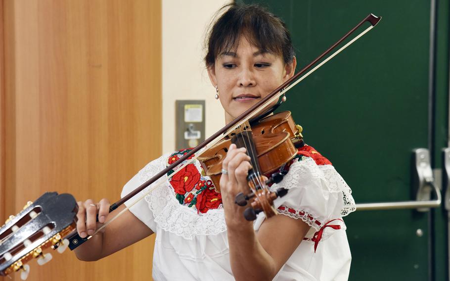 Rina Cameron plays the violin during a Hispanic Heritage Month celebration at Yokota Air Base, Japan, Sept. 15, 2023. 
