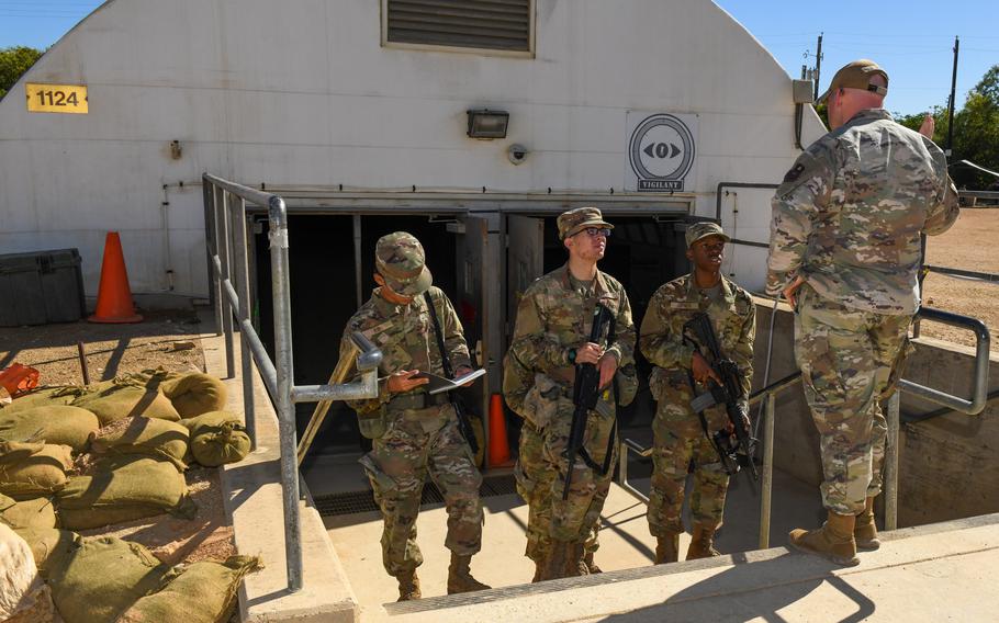 Air Force Tech. Sgt. James May, far right, guides trainees through the first phase of  PACER FORGE at Joint Base San Antonio-Chapman Training Annex, Texas,  on Oct. 26, 2022. PACER FORGE is a 36-hour exercise that tests Air Force recruits' ability to apply lessons from basic training.