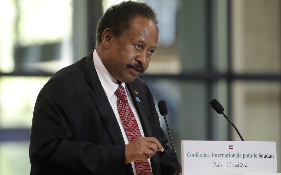 Sudanese Prime Minister Abdalla Hamdok speaks during a session of the summit to support Sudan, May 17, 2021, at the Grand Palais Ephemere in Paris. On Sunday, Nov. 21, 2021, Sudan’s military and civilian leaders signed a deal to reinstate Prime Minister Abdalla Hamdok, who was deposed in a coup last month.