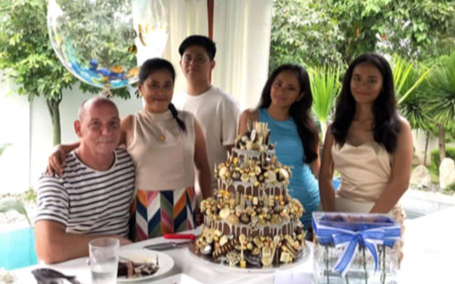 Army veteran Kevin Baltzley poses with his wife, Karen Baltzley, and his stepchildren in this undated photo taken in the Philippines.