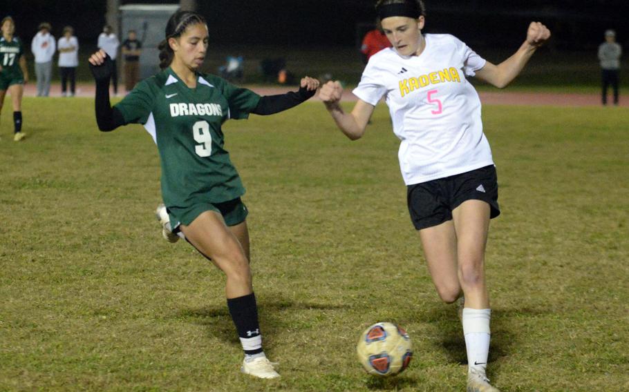 Kubasaki's Nicole Yulee and Kadena's Emma Simpson chase the ball during Wednesday's DODEA-Okinawa girls soccer match. The Dragons beat the Panthers 1-0 for the second time in two weeks.