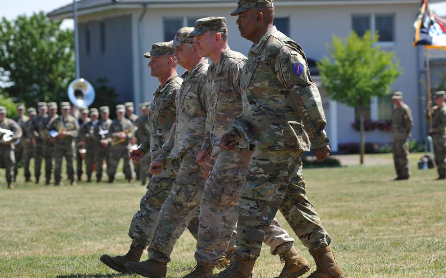 New U.S. Army Europe and Africa commander Gen. Darryl Williams, Gen. Tod Wolters, Lt. Gen. Kirk Smith and outgoing USAREUR commander Gen. Christopher Cavoli march off the parade field after Williams took command from Cavoli at a ceremony at Clay Kaserne in Wiesbaden, Germany, on June 28, 2022.