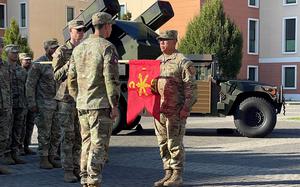 Capt. Evan Bicoy, battery commander, and 1st Sgt. Allanmarco Cruz, senior enlisted advisor, finish uncasing the unit guidon for Charlie Battery, 1st Battalion, 57th Air Defense Artillery Regiment during the units reactivation ceremony on Oct. 17, 2023 at Caserma Del Din, Vicenza, Italy. Charlie Battery became the newest Short-Range Air Defense Battery to be activated in Europe during the ceremony. 