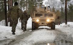 Marines operate in slushy conditions at Setermoen Military Camp, Norway, on Saturday, March 19, 2022.