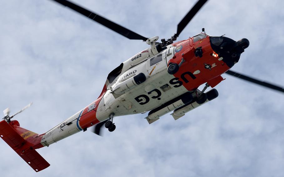 A Coast Guard MH-60 Jayhawk helicopter flies over Naval Base Coronado in Coronado, Calif. on April 11, 2016.