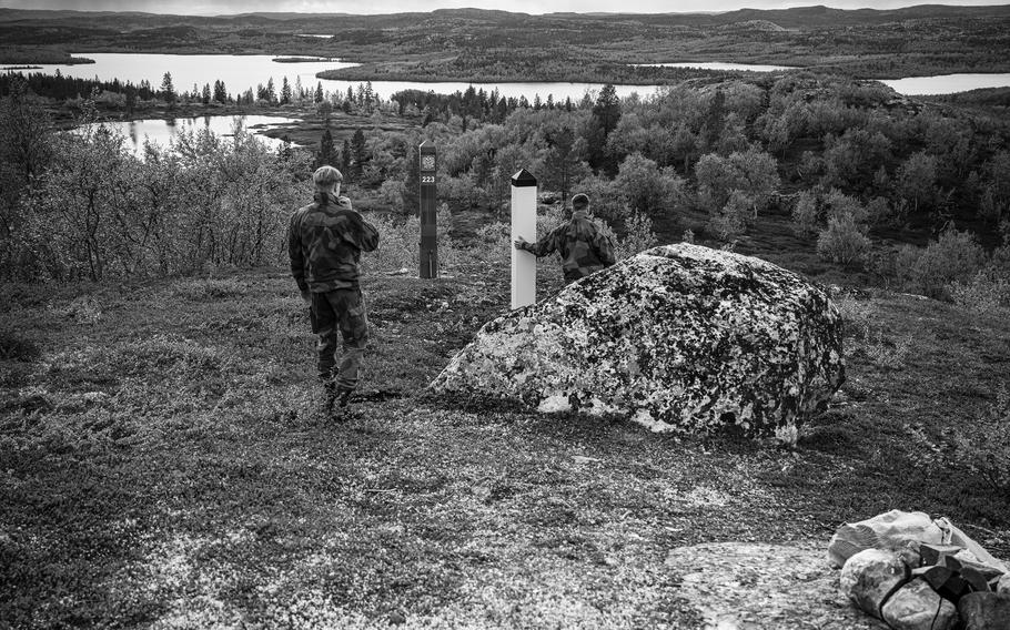 The guards inspect the official border with Russia, which is marked by two posts, one yellow for Norway, the other red for Russia. 