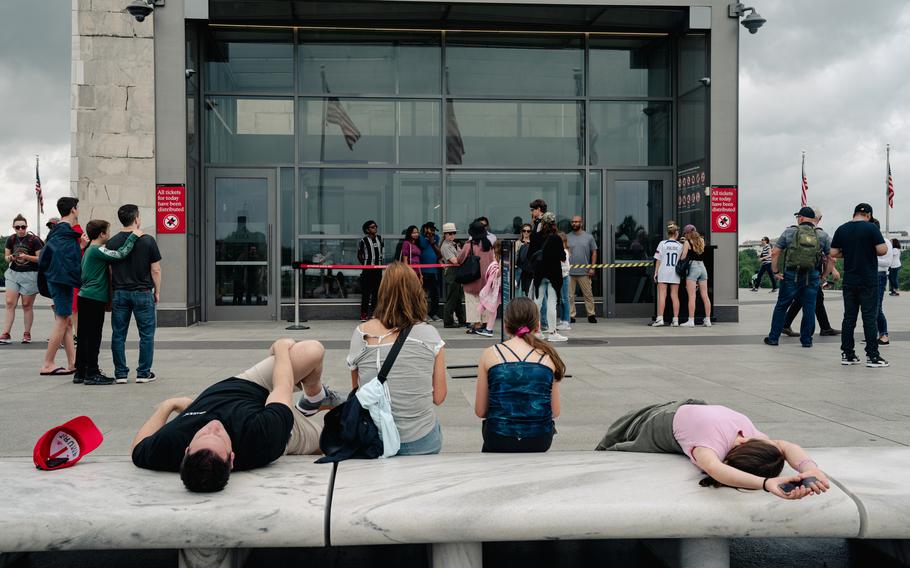 Tourists at the Washington Monument in June 2023.