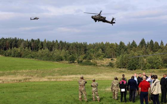 AH-64D Apache attack helicopters fly during a live-fire aerial gunnery training on Grafenwoehr Training Area, Germany, Sept. 21, 2021. African leaders attending the African Land Forces Colloquium observed the gunnery while learning about what capabilities are available at the training area.

