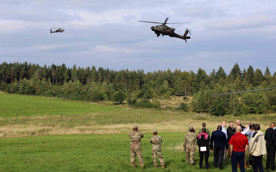 AH-64D Apache attack helicopters fly during a live-fire aerial gunnery on Grafenwoehr Training Area, Germany, Sept. 21, 2021. African leaders attending the African Land Forces Colloquium observed the gunnery while learning about what capabilities are available at the training area.