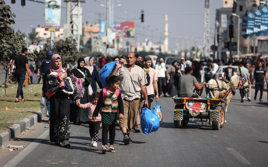 Displaced Palestinian families make their way from northern to southern Gaza on Salah al-Din Road on Wednesday. 