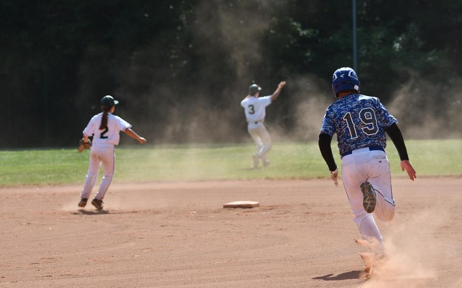 Rota’s Ethan Zehr rounds first after hitting a line drive in the left center field gap against  Naples in the team’s second game of the 2022 DODEA-Europe baseball championships.