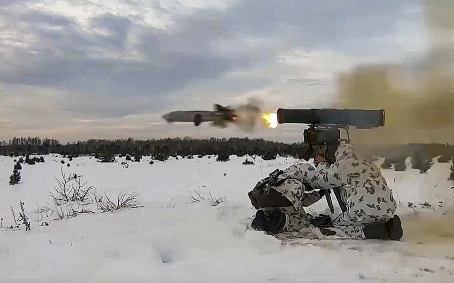 A screen grab from a video posted on Wednesday, Dec. 28, 2022, shows Russian soldiers taking part in drills at an unspecified location in Belarus.