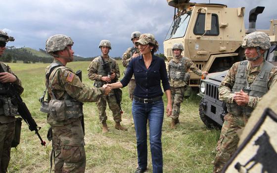 South Dakota National Guard Soldiers from the 153rd Engineer Battalion of Huron greet Gov. Kristi Noem at Barnes Canyon Camp during Golden Coyote training exercise in Custer State Park, S.D., June 14, 2019. Noem announced Tuesday, June 29, 2021, that she will join a growing list of Republican governors sending law enforcement officers to the U.S. border with Mexico.
