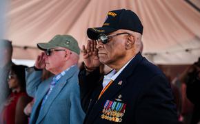 Former U.S. Marine Corps Maj. James Capers, the distinguished guest, salutes the battalion colors during a change of command ceremony for 2d Reconnaissance Battalion (Recon), 2d Marine Division, on Camp Lejeune, N.C., June 18, 2021. During the ceremony, Lt. Col. Geoffrey Hoey relinquished command of 2d Recon to Lt. Col. Eric Tee. (U.S. Marine Corps photo by Cpl. Patrick King)