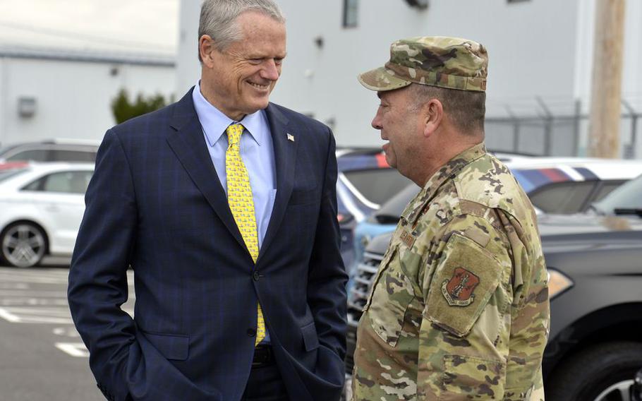 Massachusetts Governor Charlie Baker talks with Maj. Gen. Gary W. Keefe, adjutant general of the Massachusetts National Guard, prior to a ribbon cutting ceremony for the UMass Transportation Center at Westover Airport in Chicopee, Mass.