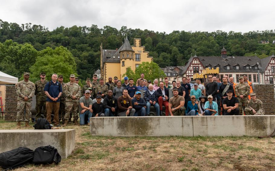 U.S and German troops pose for a photo after helping clear debris from two creeks in St. Goar, Germany, on July 11, 2022.