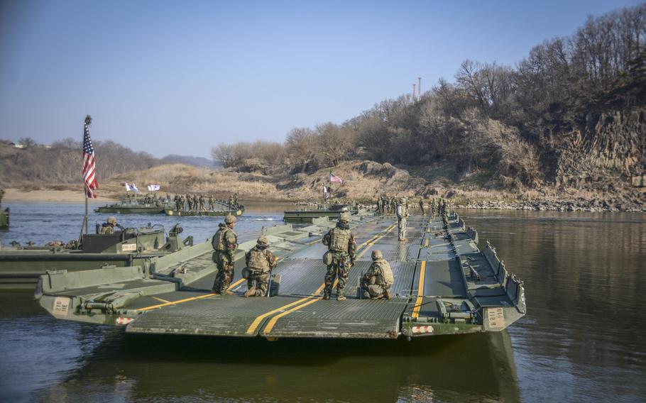 A ribbon bridge takes shape on the Imjin River during training for a wet gap crossing by U.S. and South Korean army engineers on the Imjin River, South Korea, March 20, 2024. 