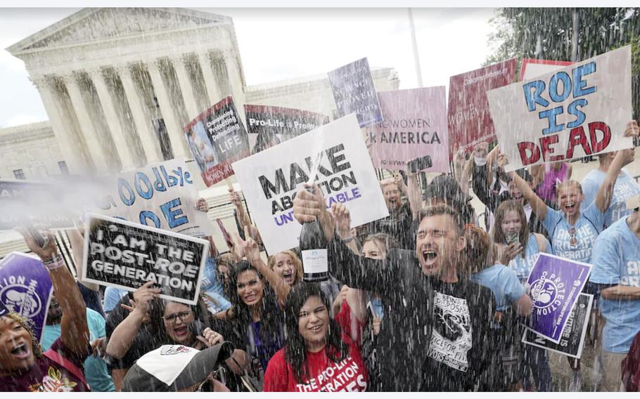 A video screen grab shows demonstrators celebrating on Friday, June 24, 2022, after the Supreme Court overturned Roe v. Wade.