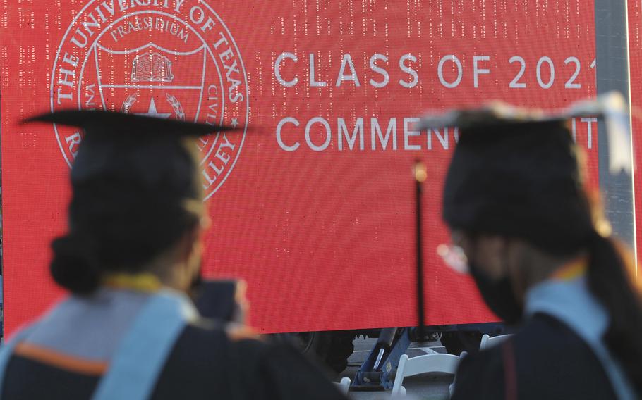 Graduates of the University of Texas Rio Grande Valley attend their commencement ceremony at the schools parking lot on Friday, May 7, 2021, in Edinburg, Texas. Graduate degrees, once touted as the new bachelor’s degrees, are becoming less crucial to get jobs. Today, more college graduates than ever hold advanced degrees, and graduate programs are the only area of higher education that saw enrollment increases during the worst of the pandemic.