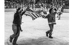 Red Grandy/Stars and Stripes
Lake Placid, N.Y., 1980: As U.S. players celebrate their victory over the Soviet Union in the famous "Miracle on Ice" game in the 1980 Olympics, two American fans carry the colors across the ice.