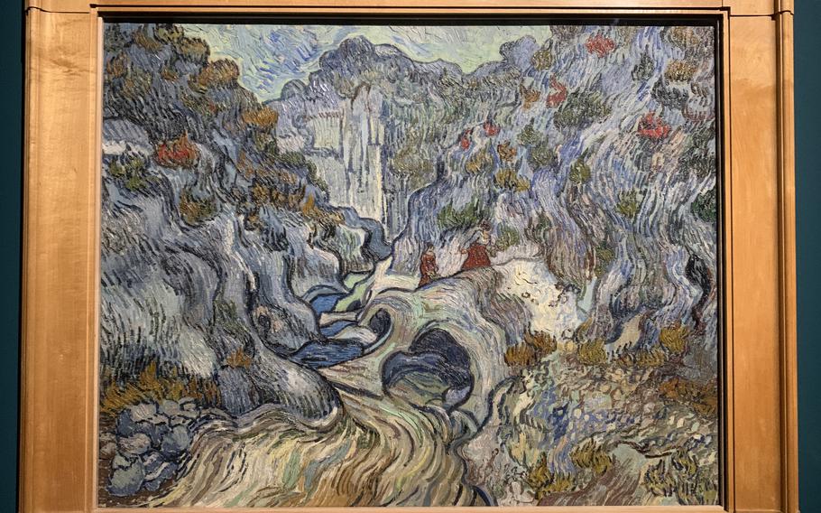 The exhibition at Palazzo Bonaparte features some of Vincent Van Gogh's paintings, such as "The Ravine," done during his stay at a French hospital due to depression.