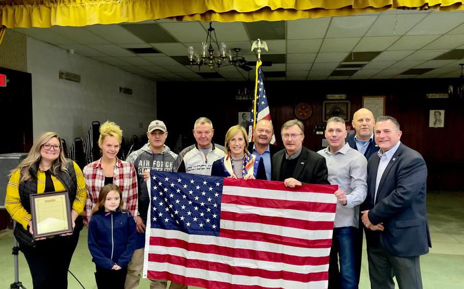 Rep. Claudia Tenney of New York presents the family of 100-year-old Thomas S. Nelson of Ilion, N.Y., with an official copy of the Congressional Record recognizing his heroism, and a flag flown over over the U.S. Capitol. The event was held at the Mohawk (N.Y.) American Legion.