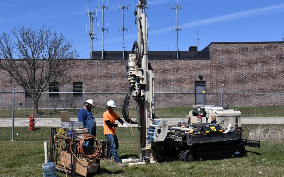 Drillers with Plains Environmental Services, Inc., conduct testing using a mobile drilling rig during a remedial investigation into the presence of per- and polyfluoroalkyl substances on March 22, 2022, at Truax Field, an Air National Guard installation in Madison, Wis.