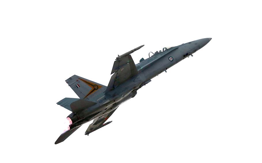An Australian fighter jet flies through the sky.