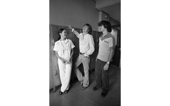 Nile C. Kinnick High School, Yokosuka, Japan, June 16, 1978: Mark Hamill, better known to many as young Jedi Luke Skywalker of Star Wars fame, chats with Melanie Shriver (18) and an unidentified student in the hallways of Nile C. Kinnick High School. Hamill - in Japan on a publicity junket for the July 1st opening of "Star Wars" in Tokyo and Osaka - took a sentimental detour to his old alma mater which he attended as a military brat when his father - a Navy Exchange officer - was stationed at Yokosuka. Reminiscing about his high school days, Hamill called himself "a plain Joe whose main hobby was girl hounding." 

Read Stars and Stripes' 1978 article and check out additional photos of Hamill's visit to Kinnick, the Yokosuka Naval Base and the USS Hammond here.
https://www.stripes.com/news/star-wars-star-mark-hamill-visits-yokosuka-alma-mater-1.19779

Check out Stars and Stripes’ 2008 interview with Mark Hamill here.

https://www.stripes.com/news/talking-with-mark-luke-skywalker-hamill-1.81182

META TAGS: Pacific; Japan; Star Wars; U.S. Navy; Nile C. Kinnick High School; celebrity; DODEA; entertainment; movies; military community; military brat; military family; Luke Skywalker; 