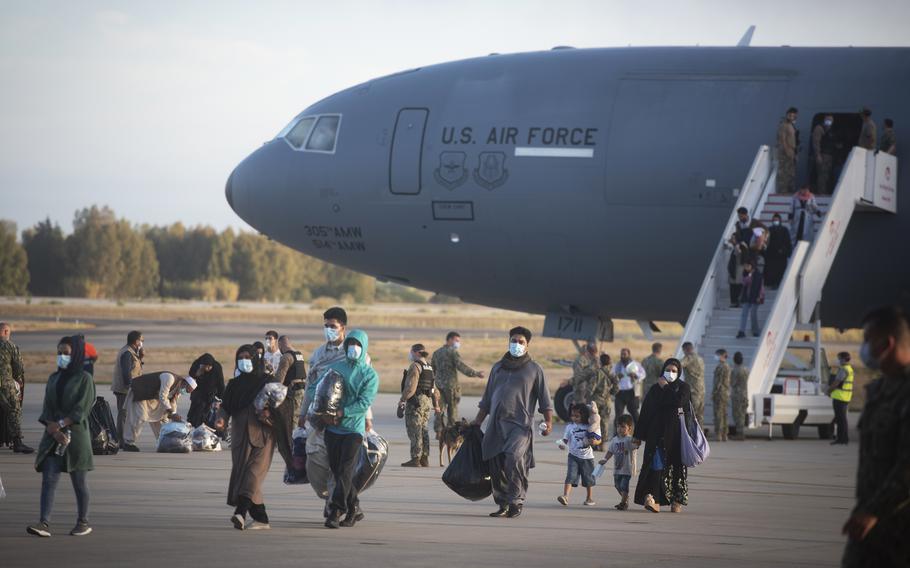 Evacuees from Afghanistan disembark from a U.S. airforce plane at the Naval Station in Rota, southern Spain, Tuesday Aug 31, 2021. The United States completed its withdrawal from Afghanistan late Monday, ending America’s longest war. 