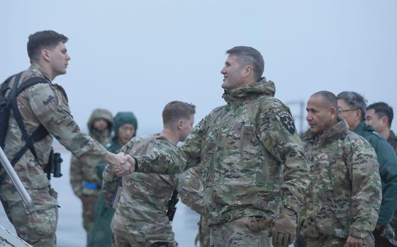 Army Maj. Gen. William Taylor greets soldiers arriving at Osan Air Base, South Korea, Feb. 21, 2024.