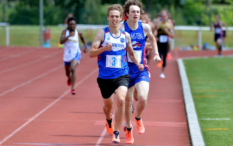 Ramstein’s Gideon Zaugg beats teammate Max Furqueron to the finish line to win the boys 800-meter race in 2 minutes, .82 second at the DODEA-Europe track and field championships in Kaiserslautern, Germany.