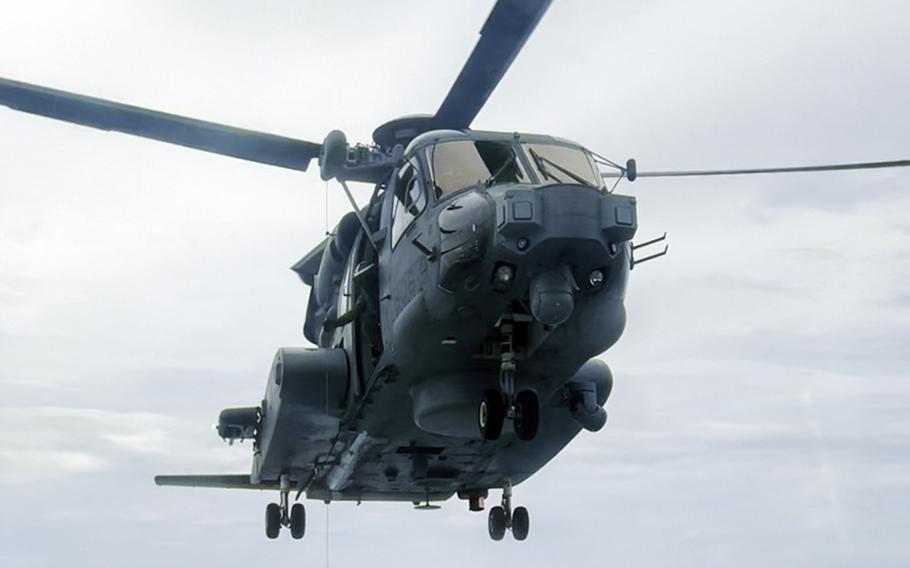 A Canadian CH-148 Cyclone helicopter approaches the guided-missile destroyer USS Ralph Johnson during training in the South China Sea, Sept. 10, 2023. 