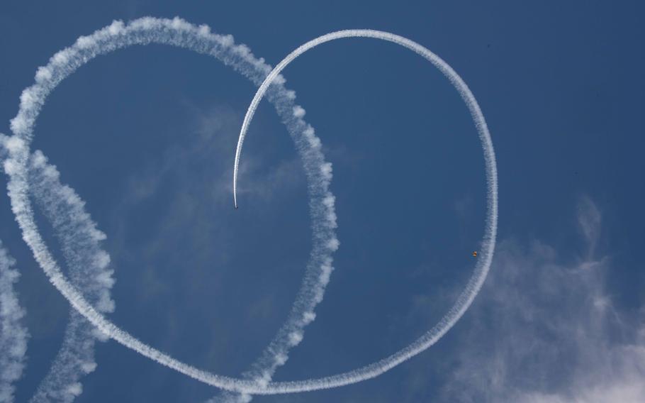 Members of the U.S. Army Golden Knights descend from the sky during the Beyond the Horizon Air and Space Show at Maxwell Air Force Base, Ala., Saturday, April 6, 2024. 